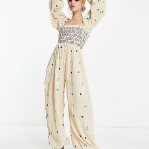 Elegant Cream Jumpsuit with Black Floral Accents